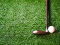 Golf ball and shaft wood on the lawn Space for text Royalty Free Stock Photo