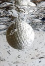 Golf ball splash 2 Royalty Free Stock Photo