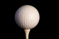 Golf ball on tee with clipping path Royalty Free Stock Photo