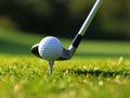 Golf ball on tee with golf club on golf course Royalty Free Stock Photo