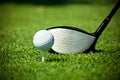 Golf ball on tee and driver Royalty Free Stock Photo