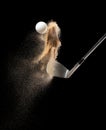 Golf ball tee explode from sand bunker. Golfer hit ball with club to sand explosion to green. Golf club hit ball tee in sand wedge Royalty Free Stock Photo