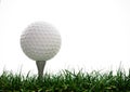 Golf ball with tee in the grass