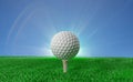 Golf ball on tee on green turf Royalty Free Stock Photo