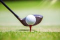 Golf ball at tee off position on green Royalty Free Stock Photo