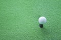 Golf ball on tee ready to be shot at a drivingrange Royalty Free Stock Photo