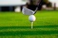 Golf ball on tee ready to be shot