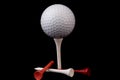 Golf ball on tee with tees