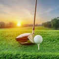 golf ball on a white tee next to a golf club on a grassy field. close-up view Royalty Free Stock Photo