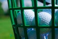 Golf balls basket Royalty Free Stock Photo