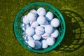 Golf balls bucket Royalty Free Stock Photo