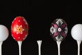 Golf balls and egg on a black glass desk Royalty Free Stock Photo