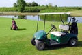 Golf buggy and golf bag Royalty Free Stock Photo