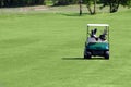 Golf buggy on golf field Royalty Free Stock Photo