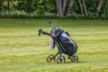 Golf caddy on a golf course Royalty Free Stock Photo