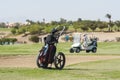 Golf caddy trolley on fairway Royalty Free Stock Photo