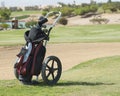 Golf caddy trolley on fairway Royalty Free Stock Photo