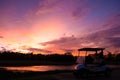 Golf cart car in fairway of golf course with fresh green grass field and cloud sky Royalty Free Stock Photo