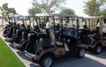 Golf cart on a golf closure. Golf carts and palm tree on blue Royalty Free Stock Photo