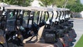 Golf cart on a golf closure. Golf carts and palm tree on blue Royalty Free Stock Photo