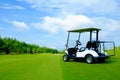 Golf cart on green lawn