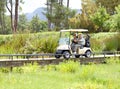 Golf cart, old couple or golfers driving on field in fitness workout or exercise on green course together. Mature male Royalty Free Stock Photo