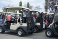 Golf carts with clubs on back