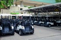 Golf carts parking in the parking area Royalty Free Stock Photo