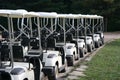 Golf Carts In A Row At A Country Club