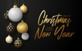 Golf Christmas card. Merry Christmas sport greeting card. Hang on a thread golf ball as a xmas ball and golden bauble on black Royalty Free Stock Photo