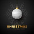 Golf Christmas card. Merry Christmas sport greeting card. Hang on a thread golf ball as a xmas ball and golden bauble on black Royalty Free Stock Photo