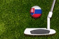 A golf club and a ball with flag Slovakia during a golf game