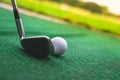 Golf club and ball in grass. drive in a hole Royalty Free Stock Photo