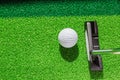 Golf club and golf ball on green grass background. Royalty Free Stock Photo