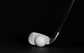 Golf club iron and ball on a lush black surface and background Royalty Free Stock Photo