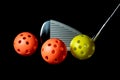 Golf Club and Plastic Practice Golf Balls on a Black Background Royalty Free Stock Photo