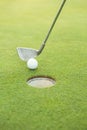 Golf club putting ball at the hole Royalty Free Stock Photo