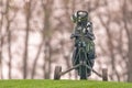 Golf clubs in a bag on a cart on a golf course. Royalty Free Stock Photo