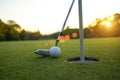 Golf clubs and ball on a green lawn in a beautiful golf course with morning sunshine Royalty Free Stock Photo