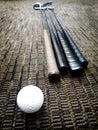 Golf Clubs and Ball in Office on Carpet Royalty Free Stock Photo