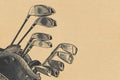 Golf clubs with ball on vintage background