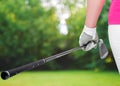 Golf clubs close up in hands the athlete Royalty Free Stock Photo