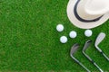 Golf concept : Panama hat, golf balls, golf iron clubs flat lay