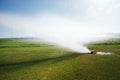 Golf course automatic lawn sprinkler Royalty Free Stock Photo