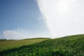 Golf course automatic lawn sprinkler Royalty Free Stock Photo