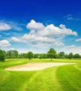 Golf course and beautiful blue sky. green field Royalty Free Stock Photo