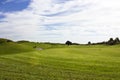 Golf course in Belek. Green grass on the field. Blue sky, sunny Royalty Free Stock Photo