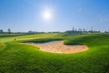 Nice golf course with bunker and nice green Royalty Free Stock Photo