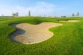 Nice golf course with bunker and nice green Royalty Free Stock Photo