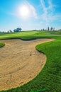 Nice golf course with bunker and nice green Royalty Free Stock Photo